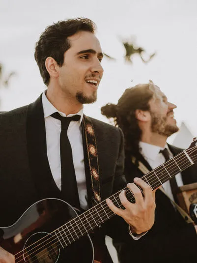 Band members strolling through a venue